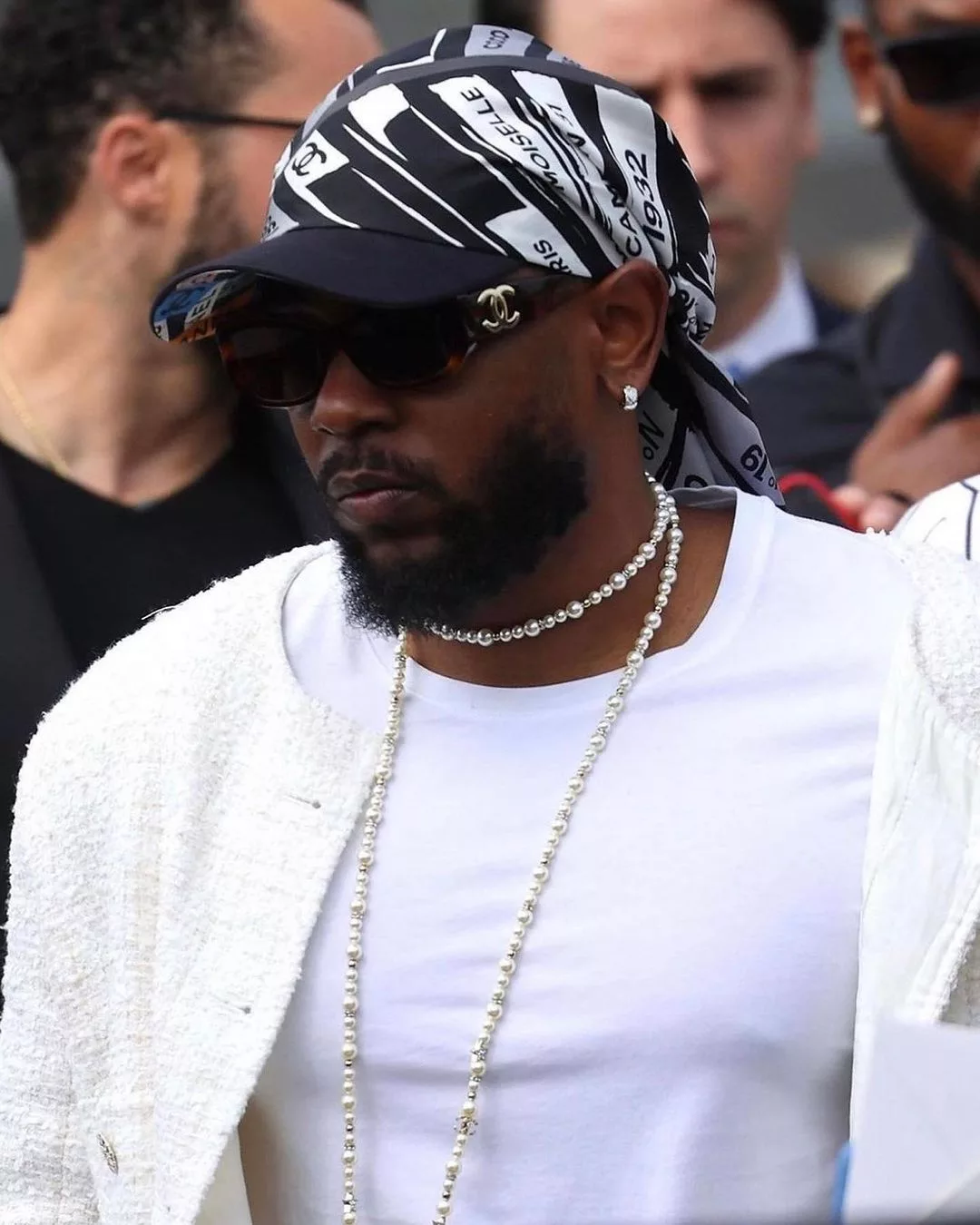 Kendrick Lamar portant du Chanel au défilé Chanel